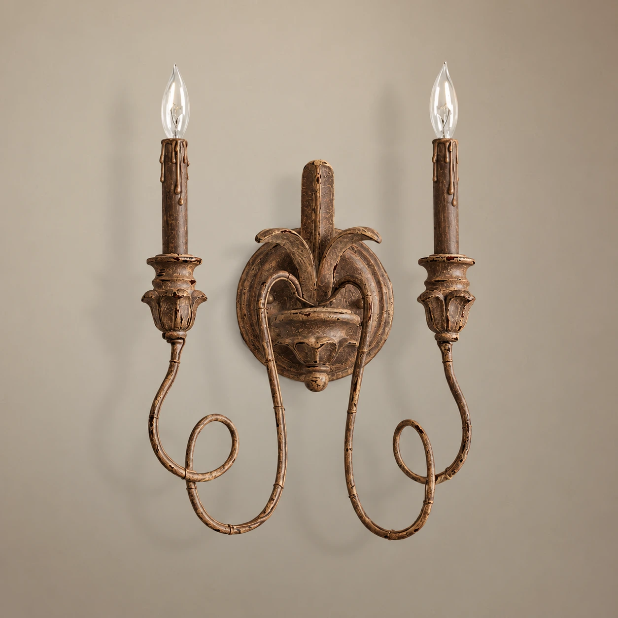 Cassia baroque wall sconce in brown aged finish on white background