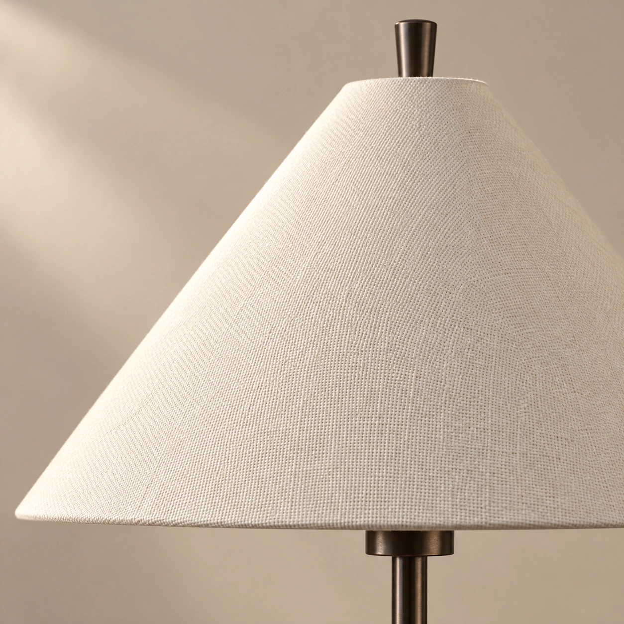 Close-up of the cream woven cone shade and lower rim