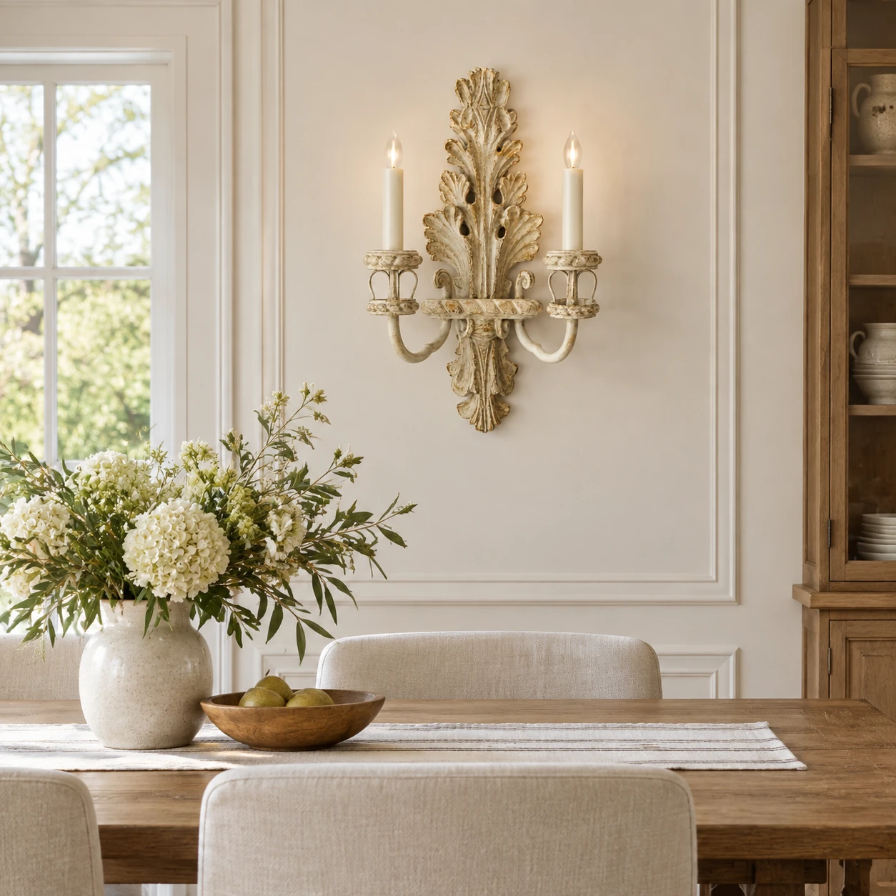 Odette French Candle Wood Wall Sconce in a residential interior