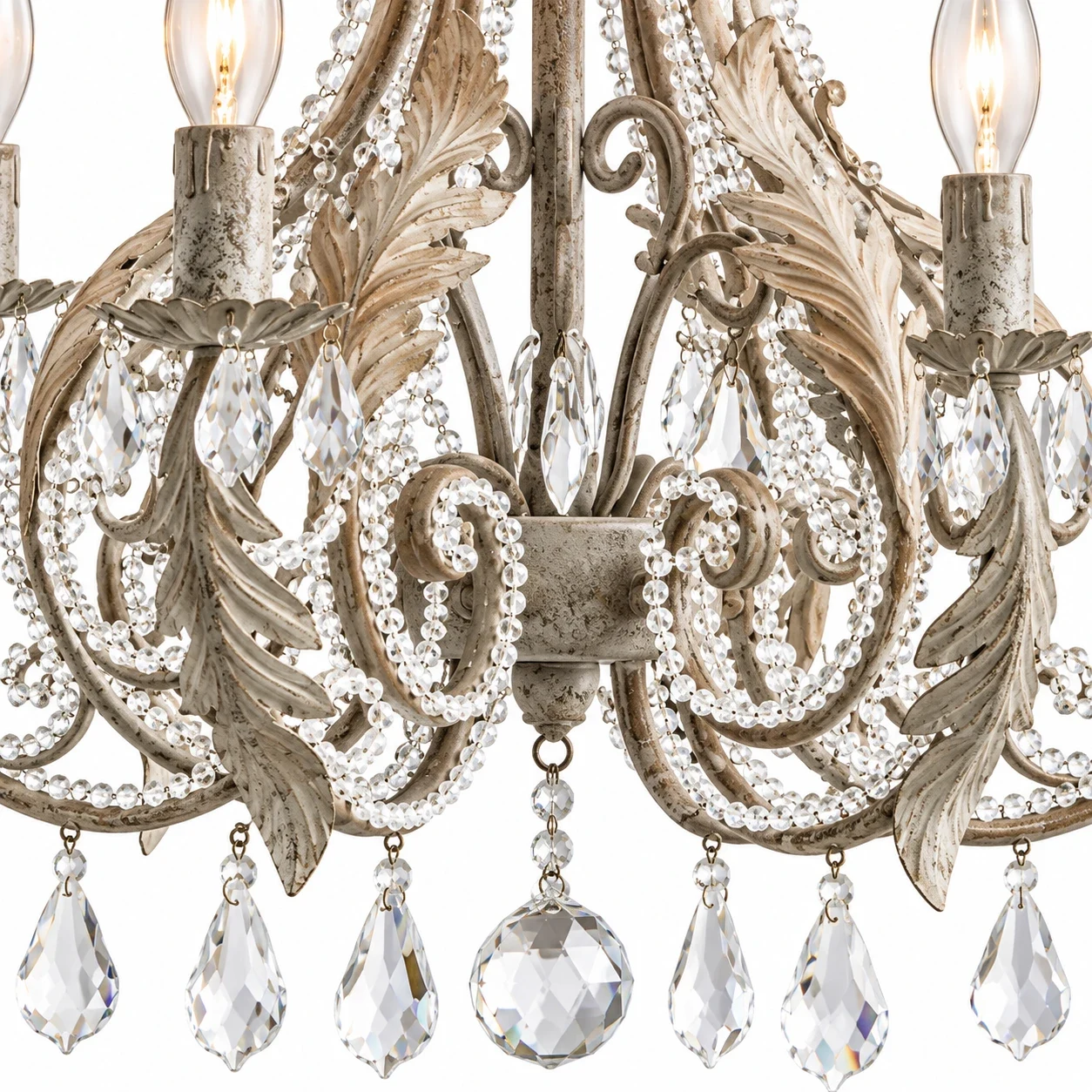 Close view of scroll leaf iron arms and crystal accents on the Camille chandelier