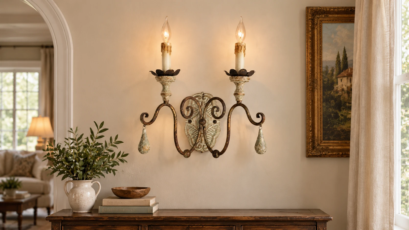 Two-light wood and iron wall sconce above an entry console