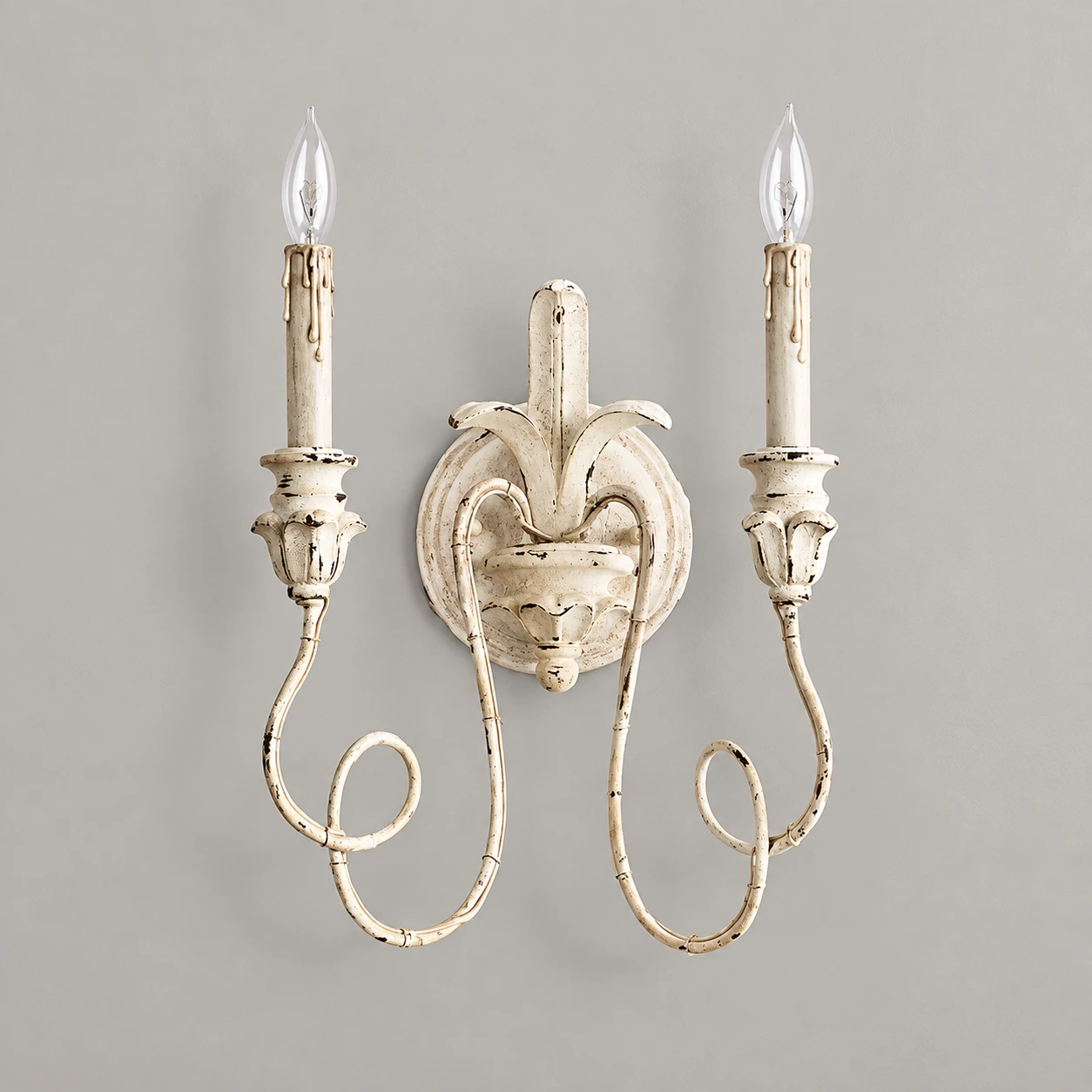 Cassia white aged two-light wall sconce on neutral plaster