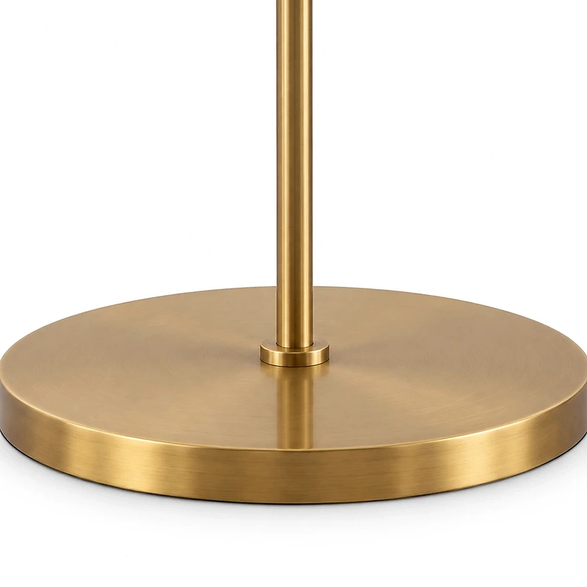 Close view of the Clara antique brass disc base and pole joint